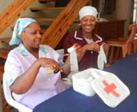 Tshidi and Ivy Practising First Aid